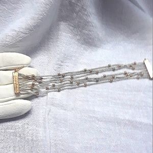 🐙 GRAB 3 ITEMS FOR 20% OFF, 7 Strand, Silver & Gold tone bracelet.